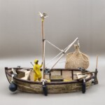 Vissersboot<br>€49,99 Gedetailleerd 3D-geprint vissersboot bouwpakket afgewerkt met echte berkenbast en houten masten.